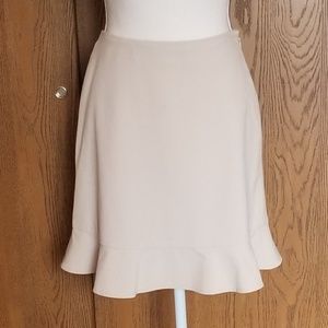 The limited tan mini skirt